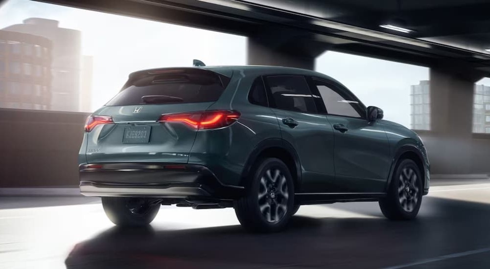A blue 2026 Honda HR-V driving in an underpass.