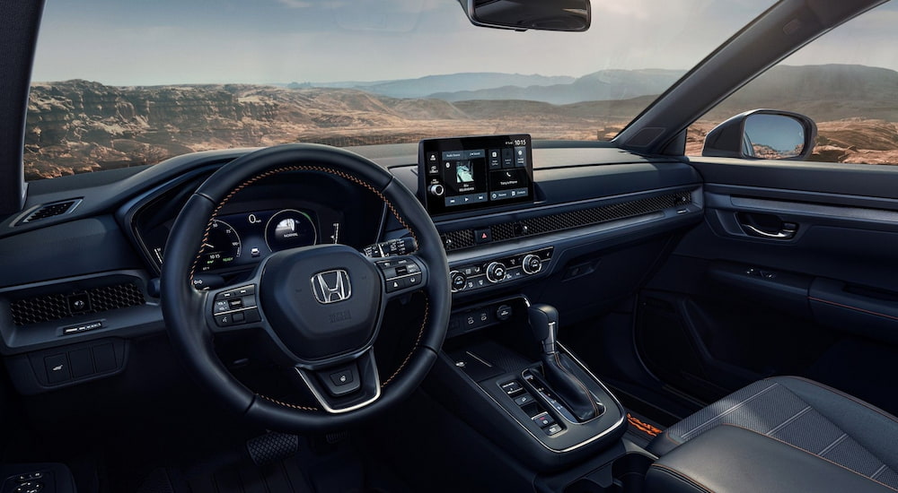 The wheel and dashboard in the interior of a 2026 Honda CR-V.