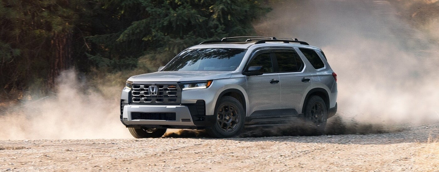 Silver 2026 Honda Pilot TrailSport kicking up dust