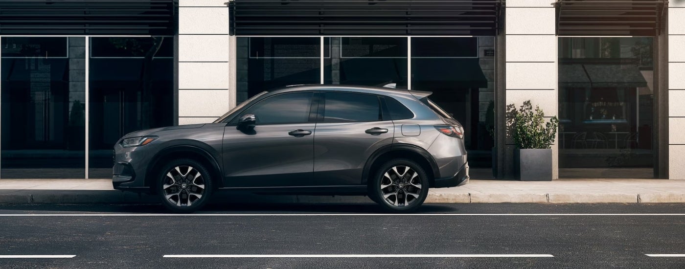 Grey 2027 Honda HR-V EX-L parked in front of a building