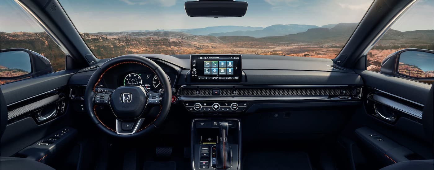 The black interior cabin of a 2024 Honda CR-V for sale.