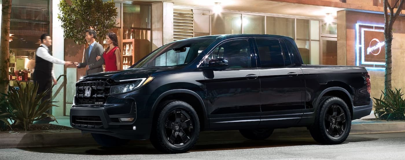 A black 2026 Honda Ridgeline Black Edition parked in a city.