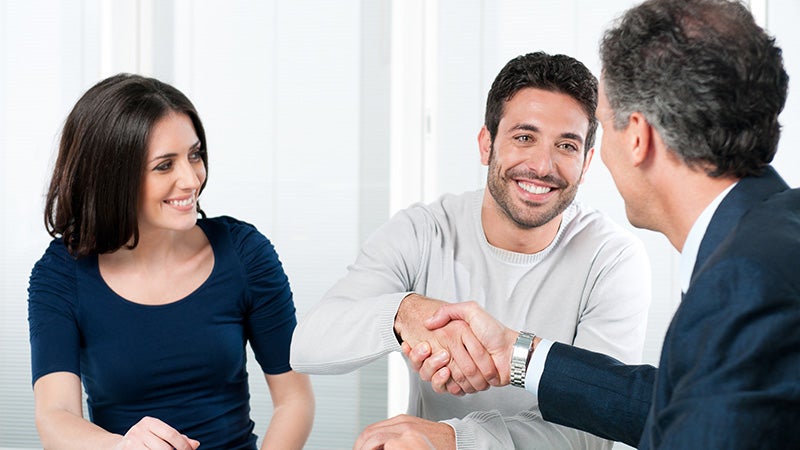 A man shaking hands with a finance manager